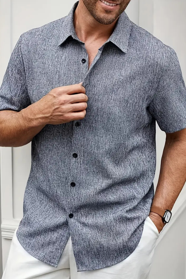 Men's short sleeve button down shirt with classic collar, relaxed fit for summer fashion. Casual wear.