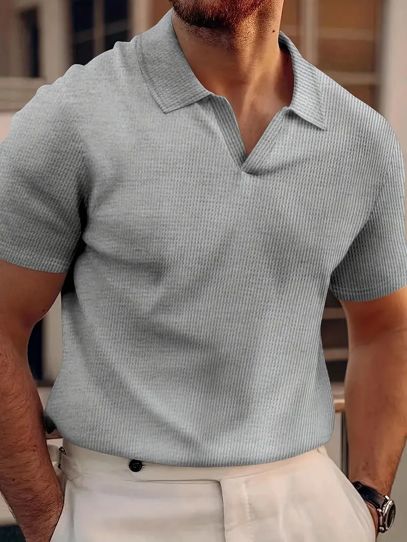 Stylish men's short-sleeve polo shirt, perfect for a versatile smart casual look.