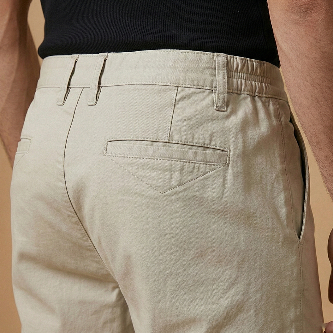 A man wearing casual structured fit shorts, perfect for warm weather activities.
