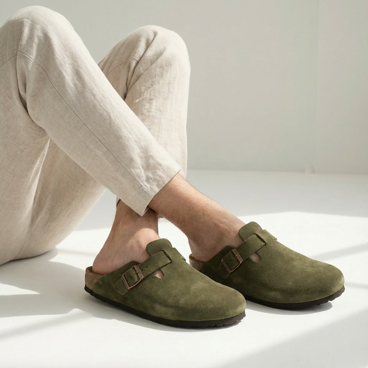 Comfortable men's slip-on clog mules in soft suede, perfect for indoor and outdoor wear.
