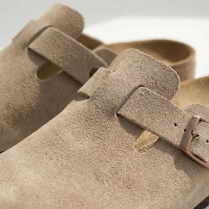 Versatile men's casual footwear: suede clog mules with a secure buckle strap.
