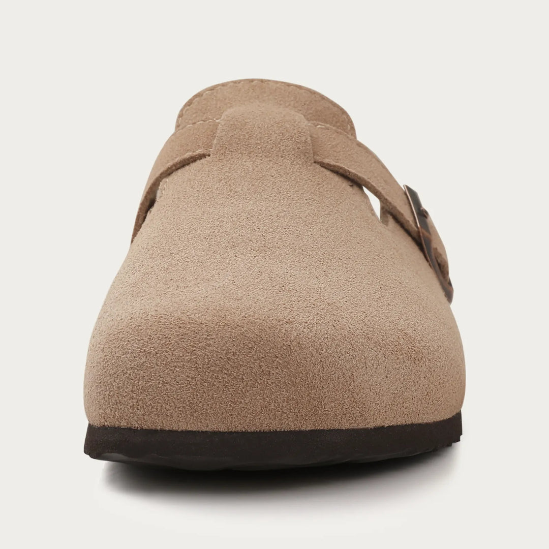 Close-up of men's casual suede clog mules showcasing the buckle strap detail.