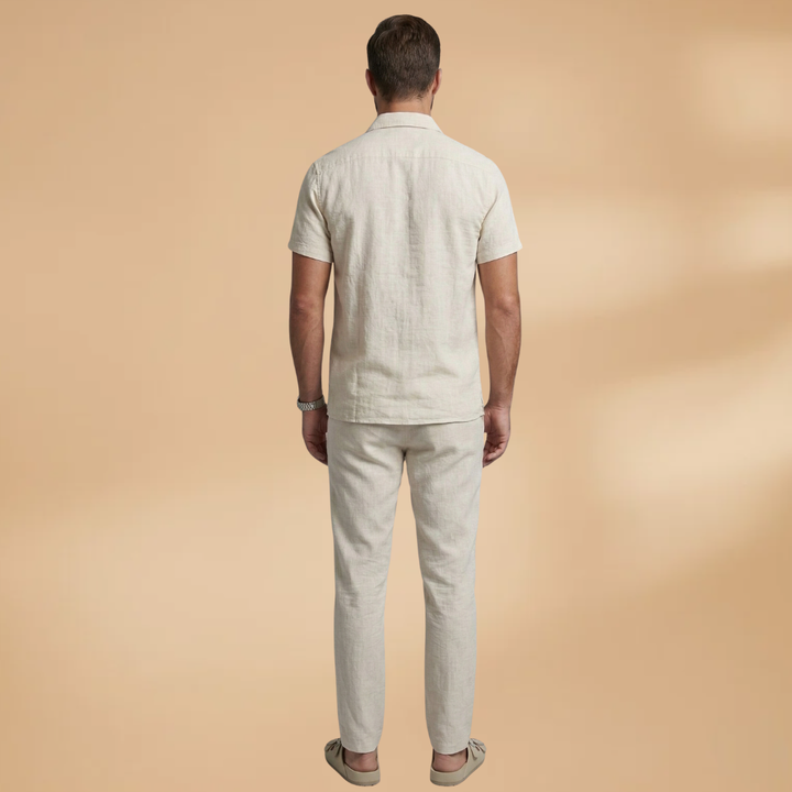 Comfortable men's two-piece summer set: short-sleeve shirt & straight-leg pants. Relaxed fit for warm weather.
