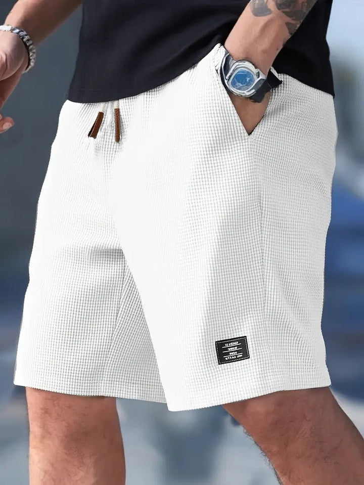 Side view of men's comfortable casual summer shorts, highlighting effortless warm-weather style.