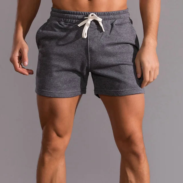 Man wearing comfortable men's casual shorts with pockets, ideal for summer activities & everyday style.