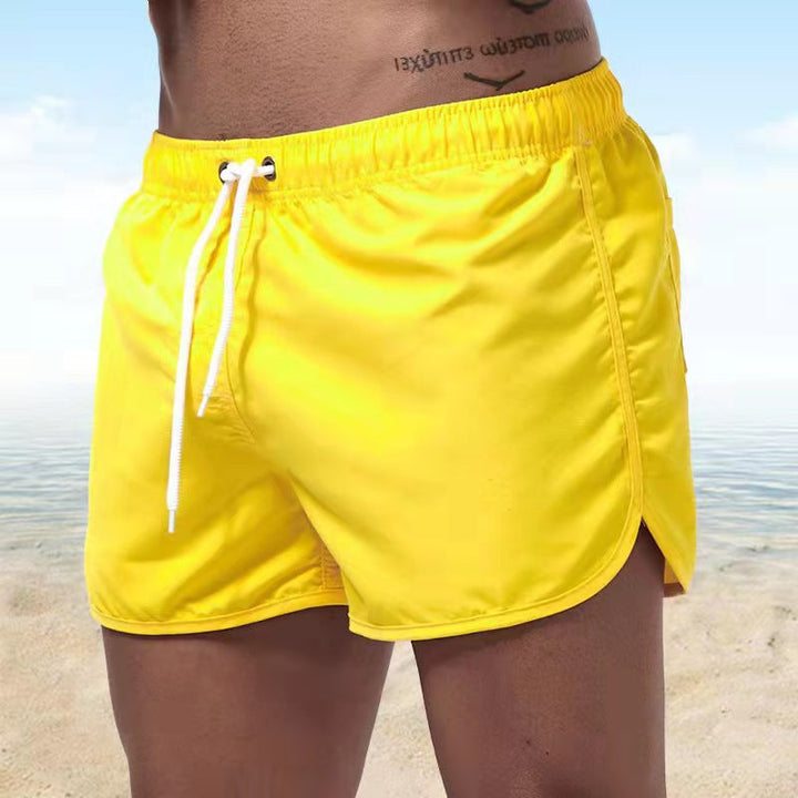 Comfortable men's swim shorts featuring an adjustable waistband, ideal for summer beachwear.