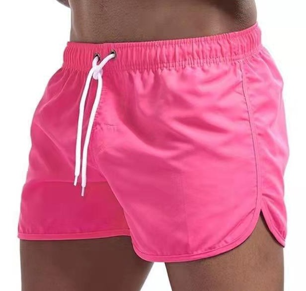 Casual men's swimwear shorts, great for beach, pool, and summer vacation with adjustable fit.