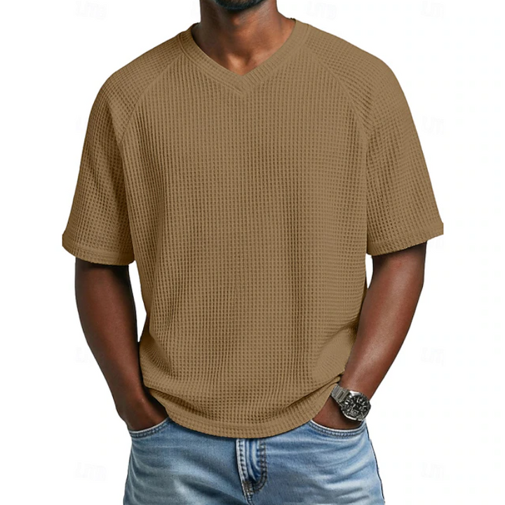 Comfortable men's short sleeve V-neck shirt with textured fabric, versatile for casual summer outfits.