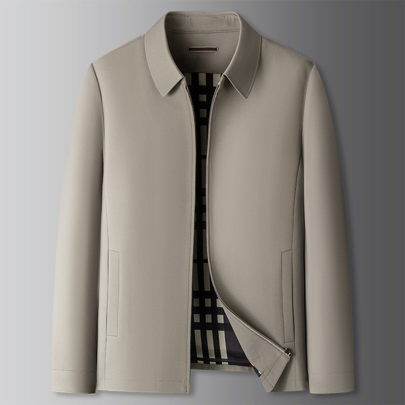 A man in a beige Harrington jacket, showcasing its lightweight and versatile style.