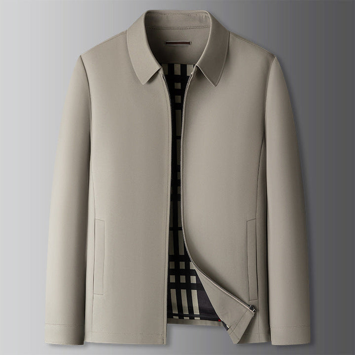 A man in a beige Harrington jacket, showcasing its lightweight and versatile style.