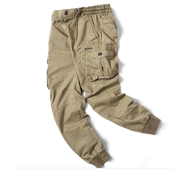 Model wearing slim tapered leg Charlie cargo pants for a casual look.