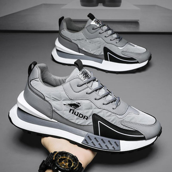 Men's chunky lace-up sneakers with bold platform sole, perfect for fashion-forward casual wear.