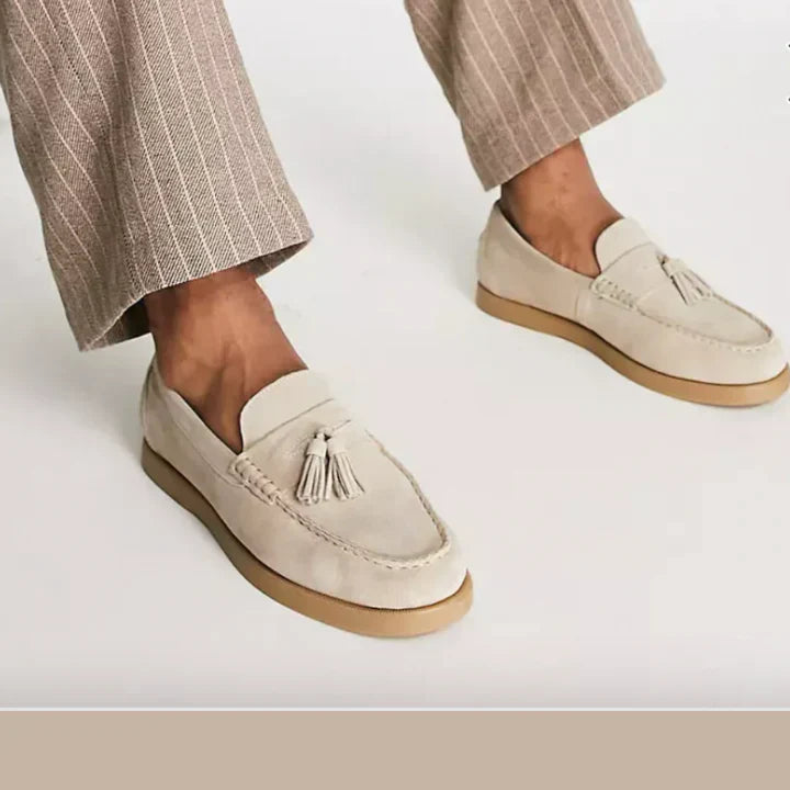 Comfortable men's suede loafers in timeless beige, versatile for any occasion.