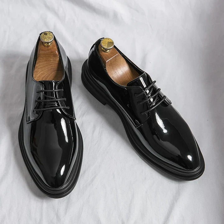 Men's classic black lace-up Oxford dress shoes for timeless formal style and professional business attire.