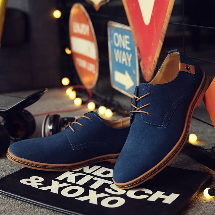 Men's Classic Oxford shoes paired with a suit, ideal formal footwear for elegant occasions & business.