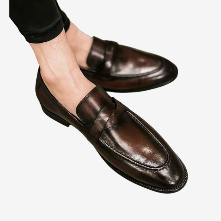 Comfortable men's leather penny loafers. Versatile slip-on business shoes with timeless classic style.