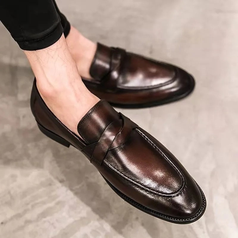 Sleek black men's penny loafers. Comfortable slip-on shoes for the office, formal events, and smart casual attire.