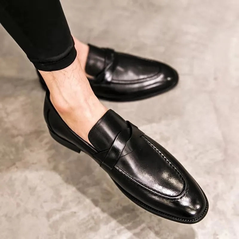 Classic men's style penny loafers. Elegant slip-on shoes perfect for business casual or formal dress wear.