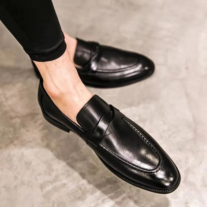 Classic men's style penny loafers. Elegant slip-on shoes perfect for business casual or formal dress wear.