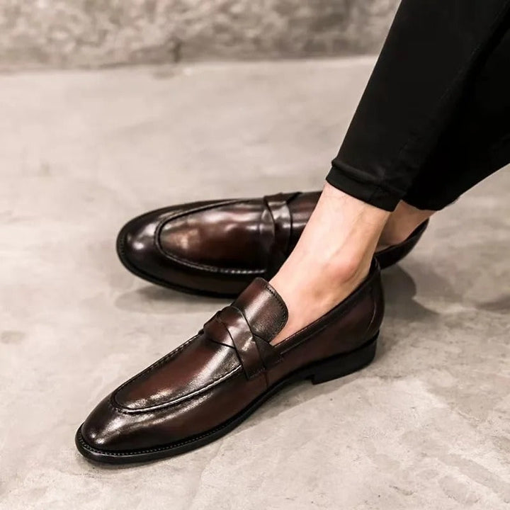 Versatile men's slip-on penny loafers. Comfortable classic dress shoes for work, events, and smart casual occasions.