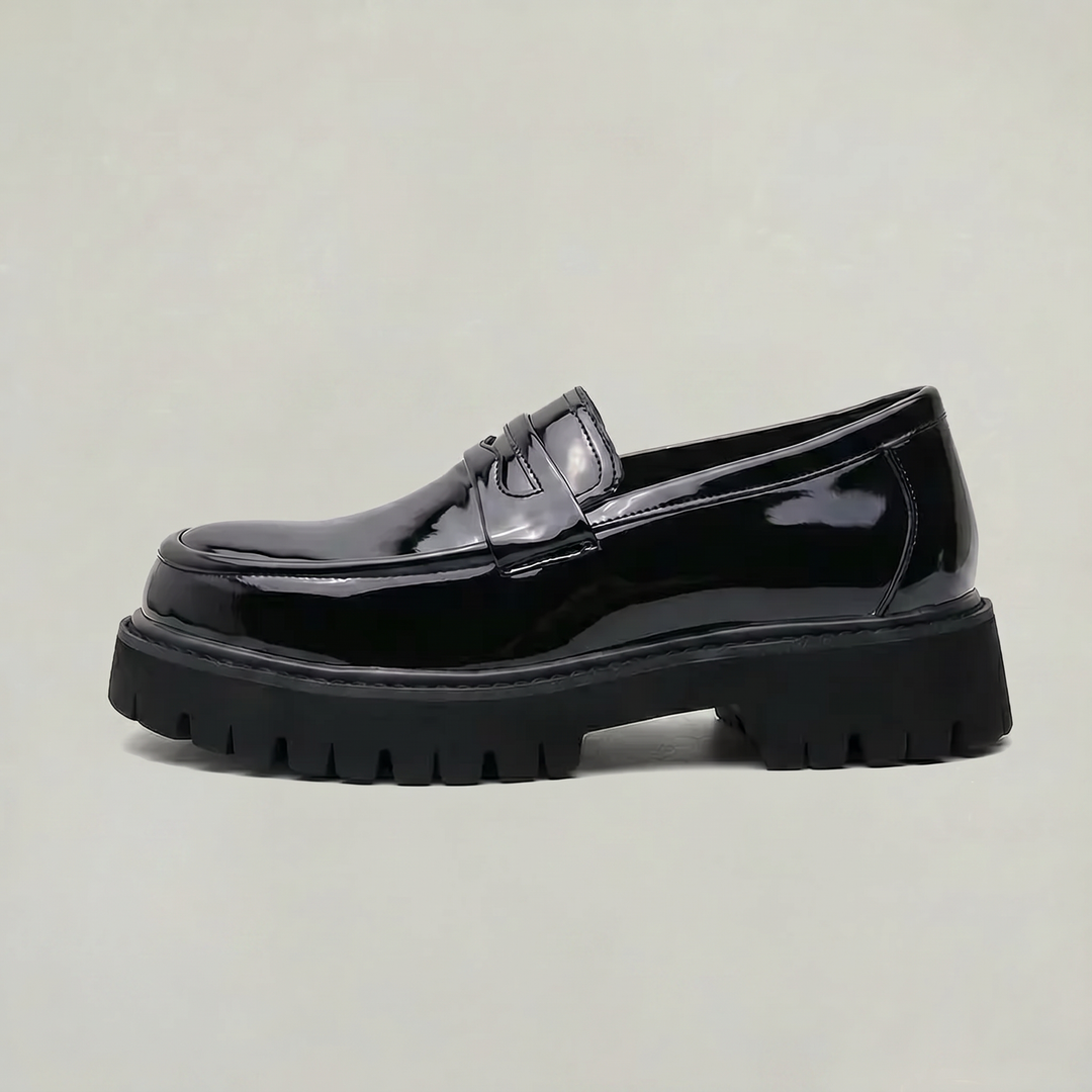 Men's classic black penny loafers with a modern platform sole. Perfect for smart casual or dress wear.