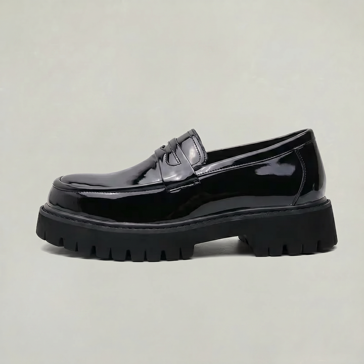 Men's classic black penny loafers with a modern platform sole. Perfect for smart casual or dress wear.