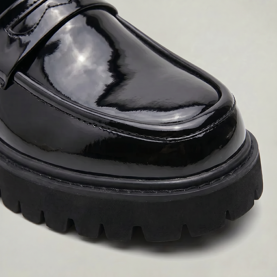 Classic men's penny loafers updated with a stylish platform sole, offering a modern and polished look.