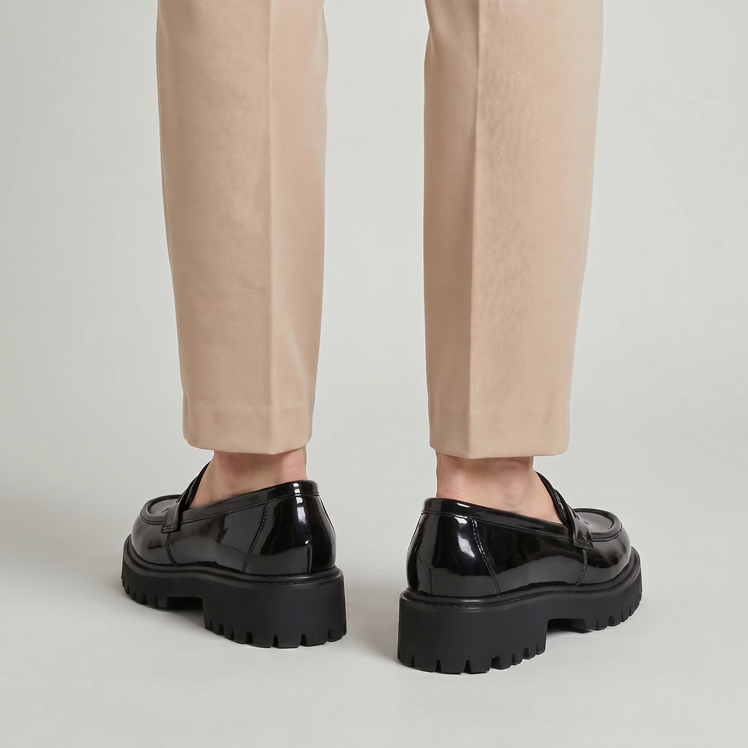 Men's platform penny loafers, slip-on dress shoes with a chunky sole. Modern men's footwear for a polished look.
