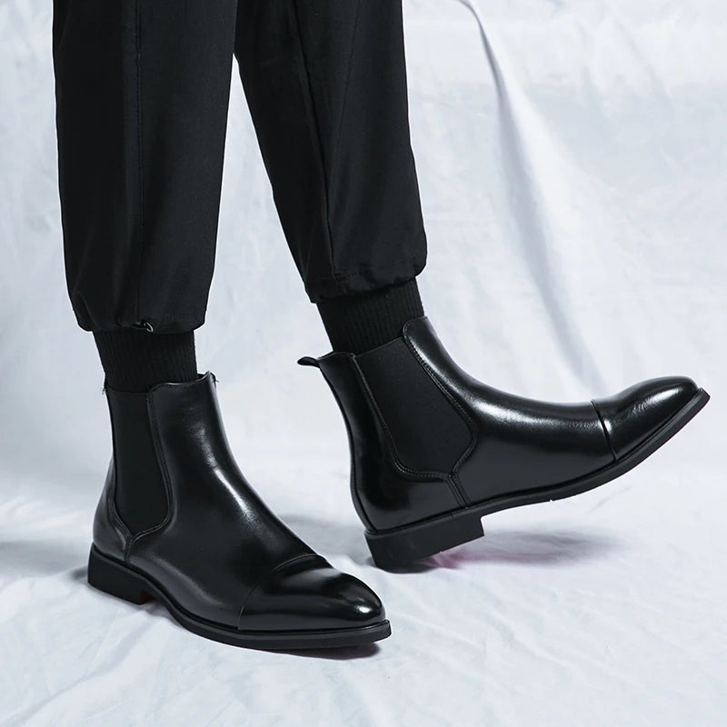Men's classic black slip-on Chelsea boots with elegant cap toe design, perfect for smart casual or dress wear.