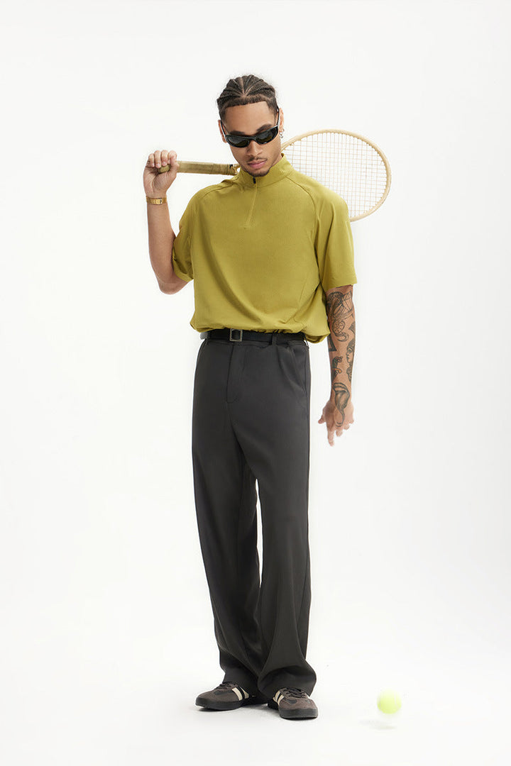 Man in comfortable wide leg chinos with a t-shirt, showcasing versatile casual wear and relaxed fit styling.