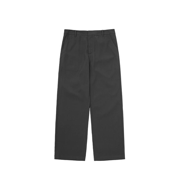 Detail of the high waist on men's wide leg trousers, ensuring comfort and a flattering, tailored fit.