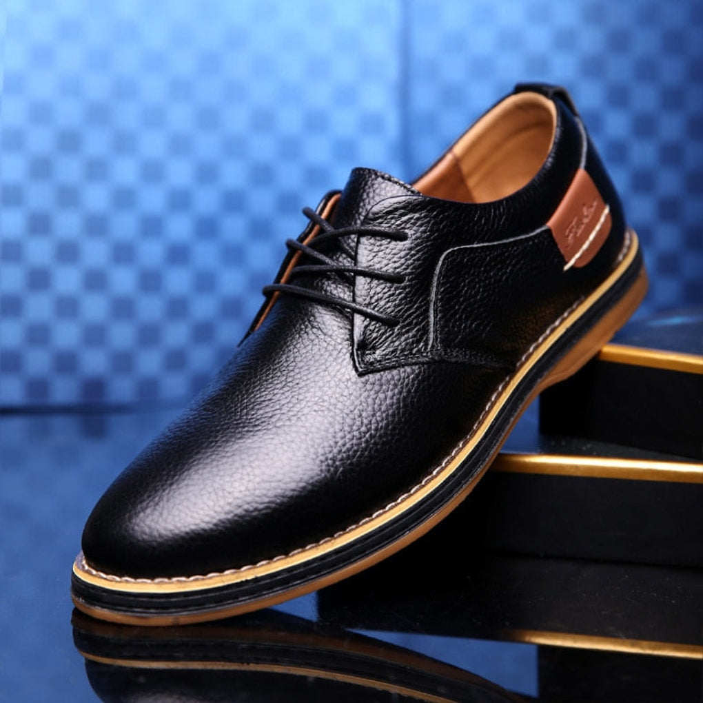 Stylish brown leather men's Oxford dress shoes, versatile for any outfit.