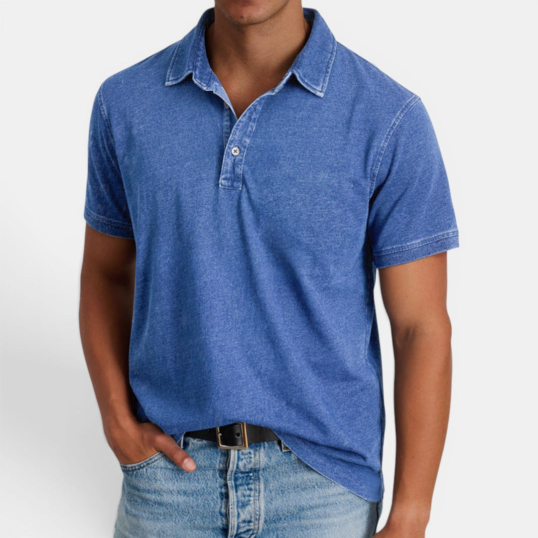 Men's classic blue polo shirt, short sleeve, button collar. Effortless style for smart casual & everyday wear.