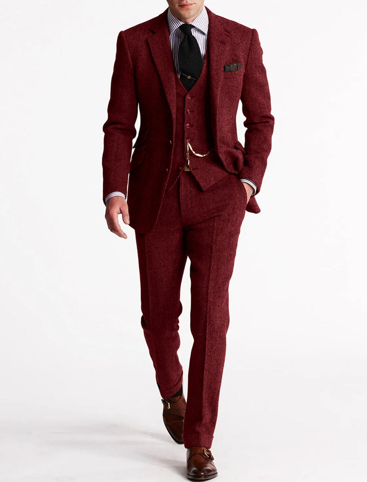 Men's tailored brown tweed suit, including jacket, waistcoat, and trousers.