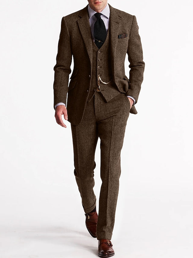 Close-up of the lapel detail on a men's brown herringbone formal suit.