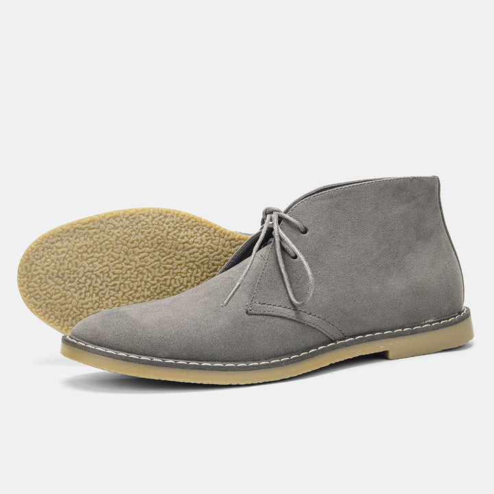 Men's brown leather boots with durable sole, designed for comfort and long-lasting wear.