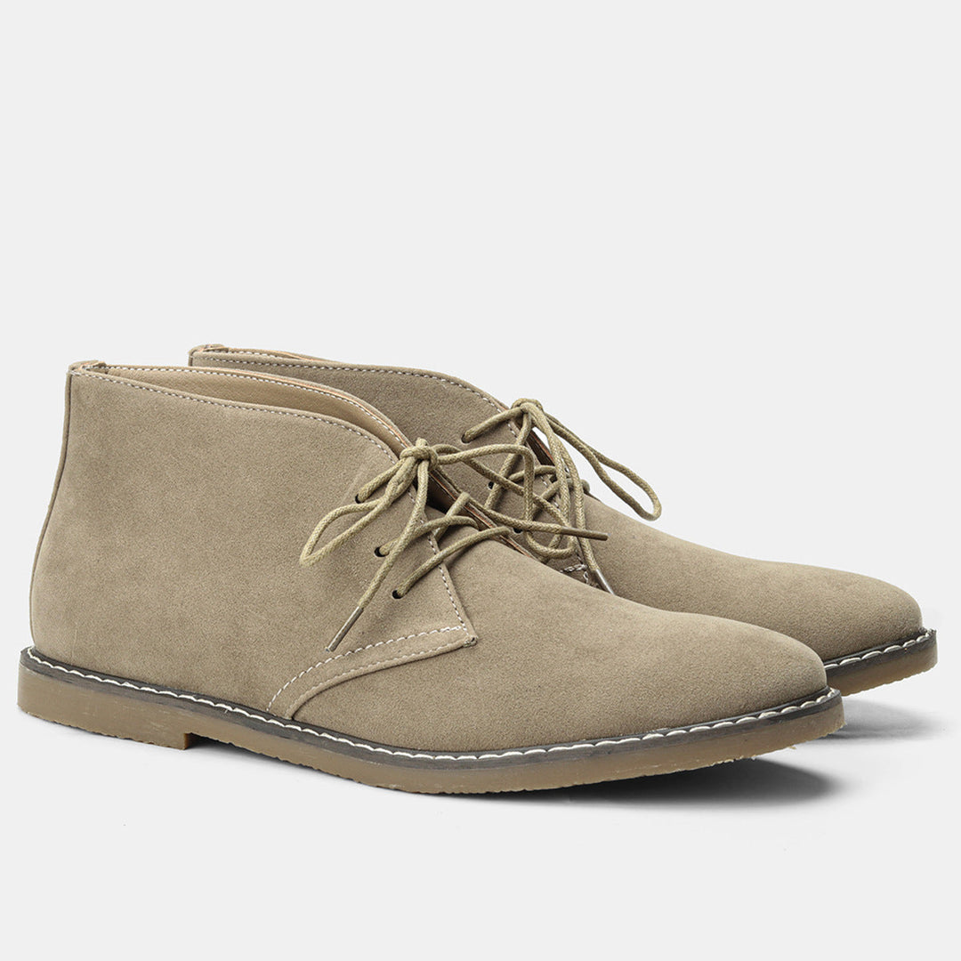 Pair of men's classic leather boots, showcasing vintage appeal and rugged durability.