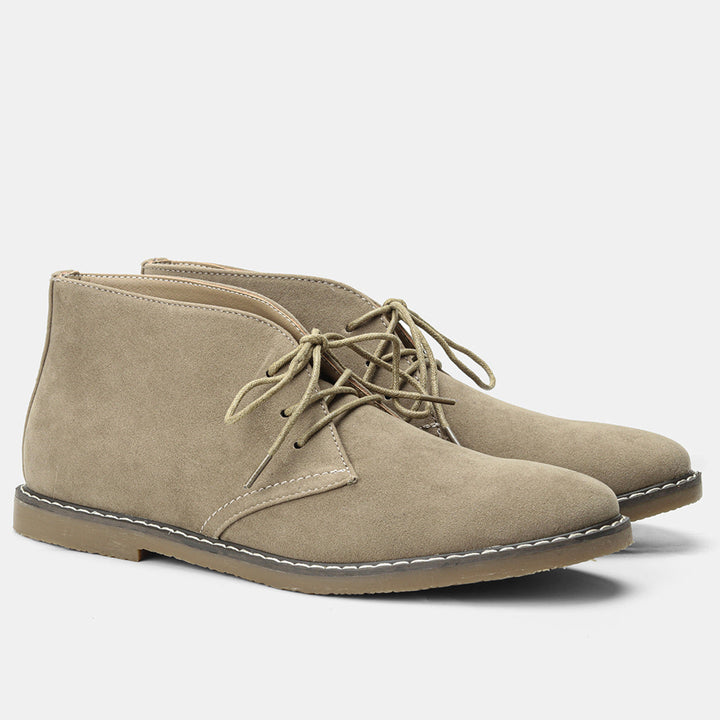 Pair of men's classic leather boots, showcasing vintage appeal and rugged durability.