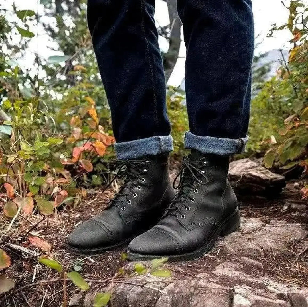 Durable men's black lace-up cap-toe ankle boots offering timeless style & comfort for daily fashion.