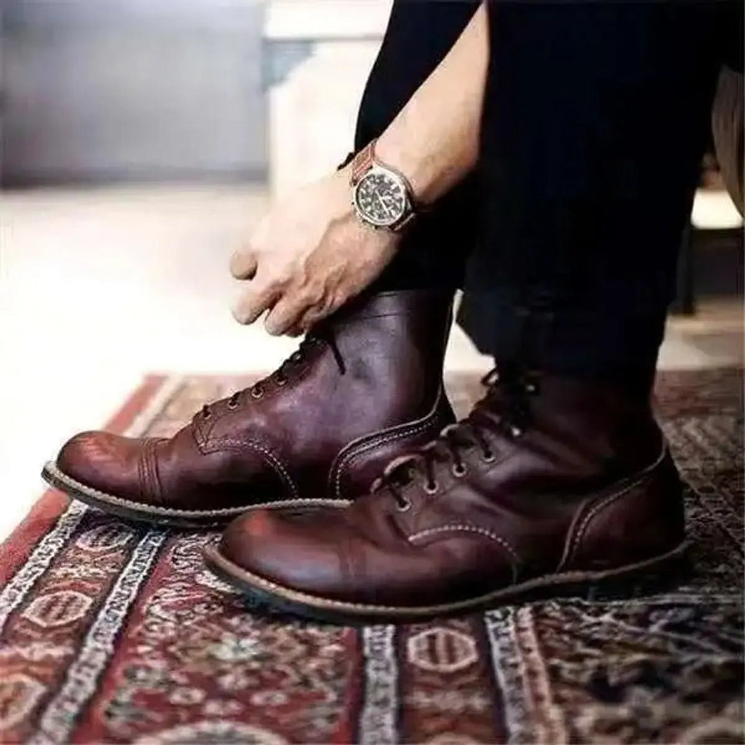 Stylish men's versatile tan lace-up ankle boots with a sophisticated cap-toe design for all occasions.