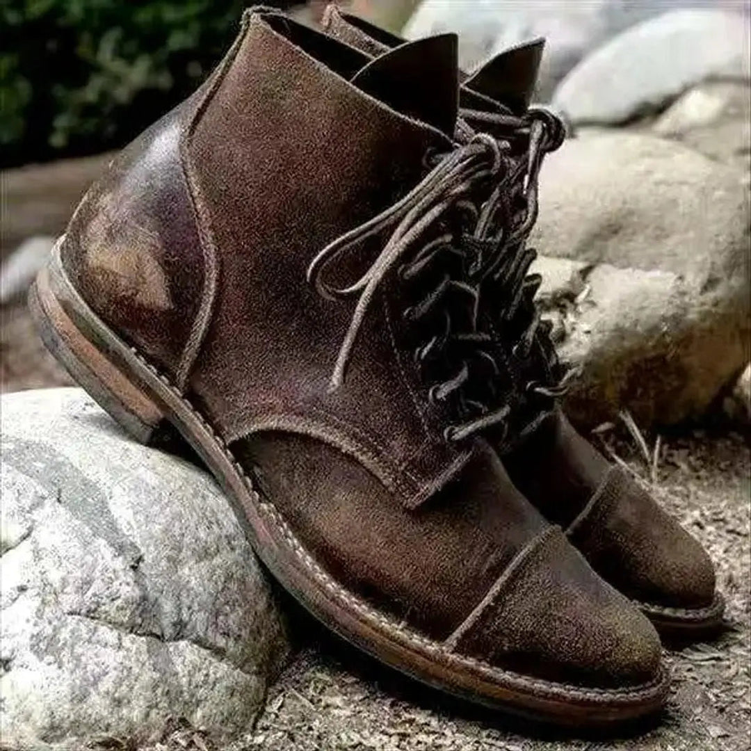 Elegant men's dark brown leather cap-toe lace-up ankle boots, perfect for casual & smart fashion outfits.