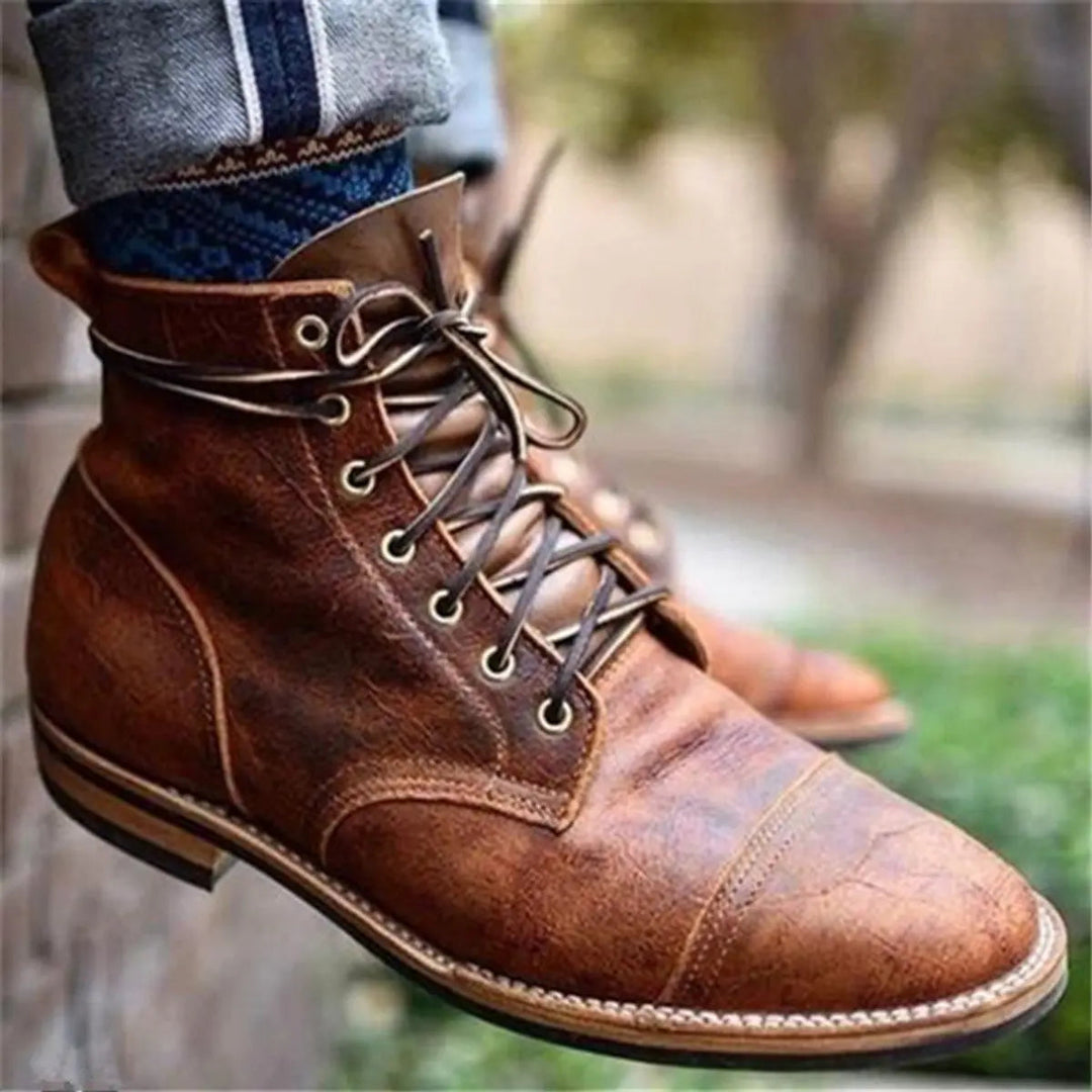 Classic men's durable lace-up cap-toe ankle boots in rich leather, a versatile choice for modern fashion.
