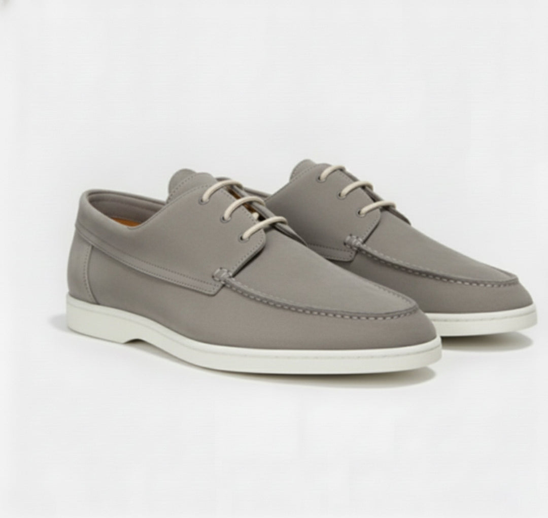 Close-up of premium leather men's loafers, highlighting fine stitching and elegant texture.