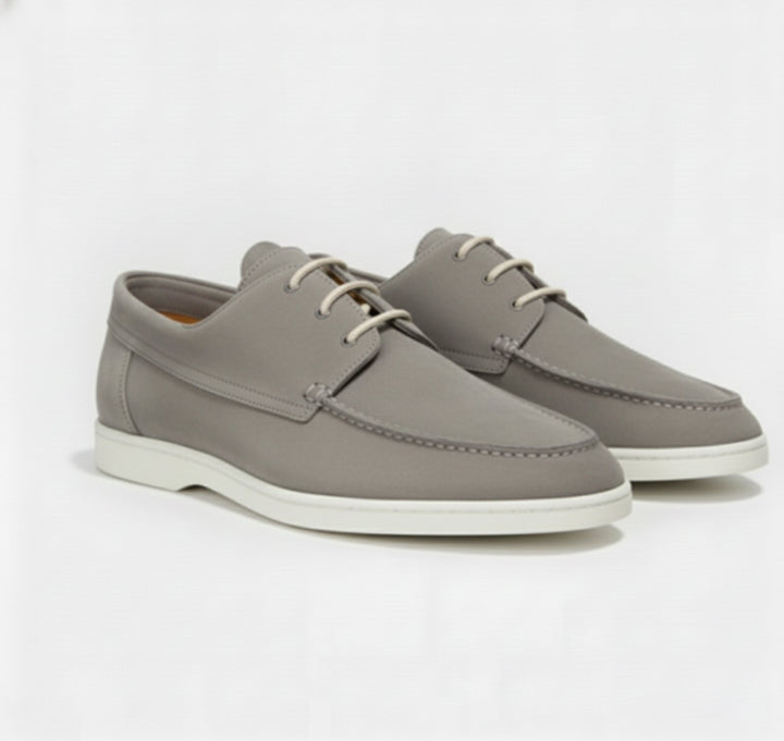 Close-up of premium leather men's loafers, highlighting fine stitching and elegant texture.