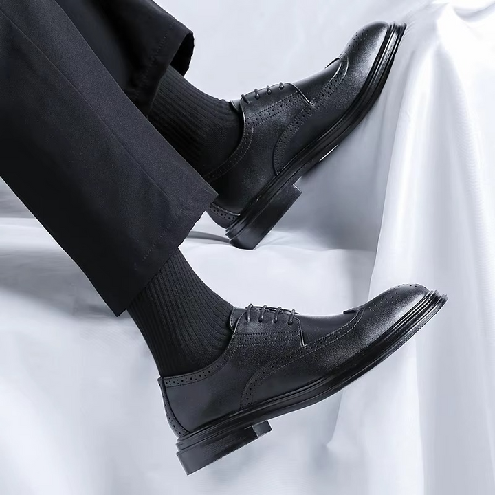 Refined men's classic brown wingtip brogue Derby dress shoes, versatile formal footwear for elegant outfits.