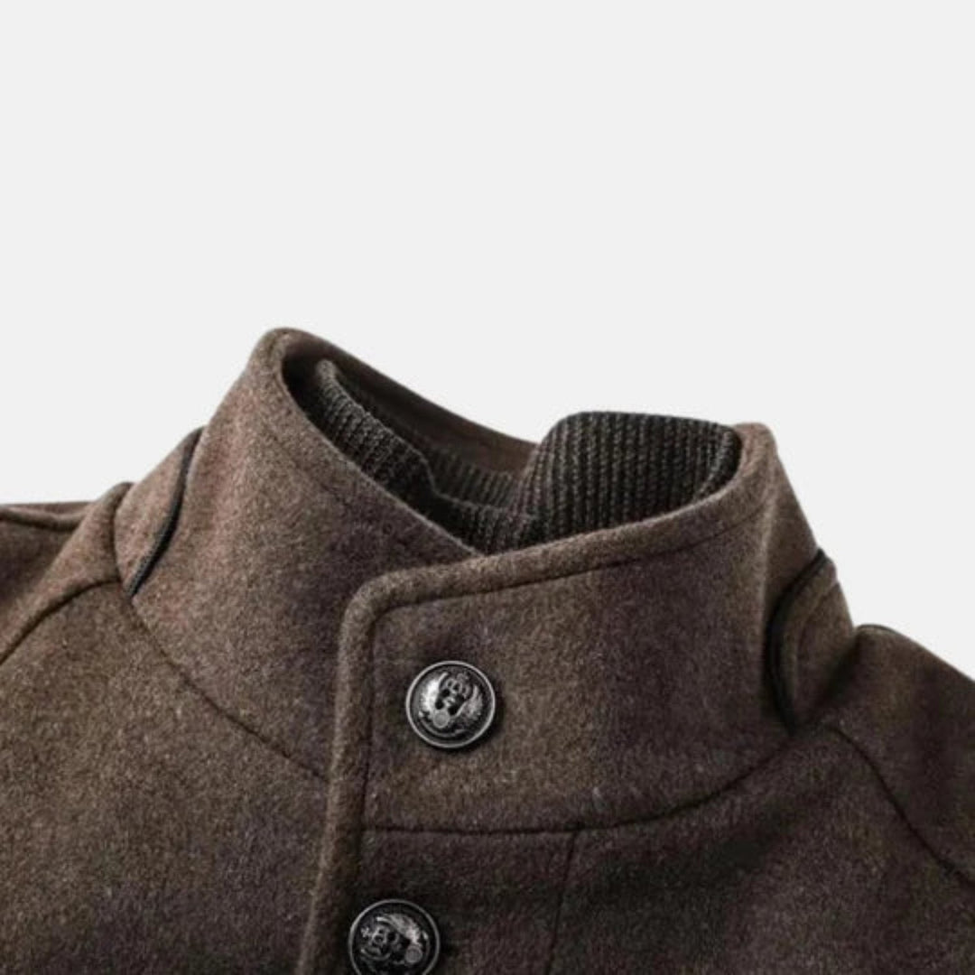 Modern men's gray mid-length overcoat, offering elevated style and comfort for cooler seasons.