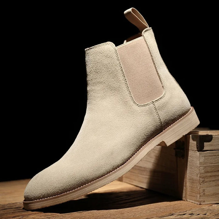 Side view of men's taupe suede slip-on ankle boots, elasticated side panels.