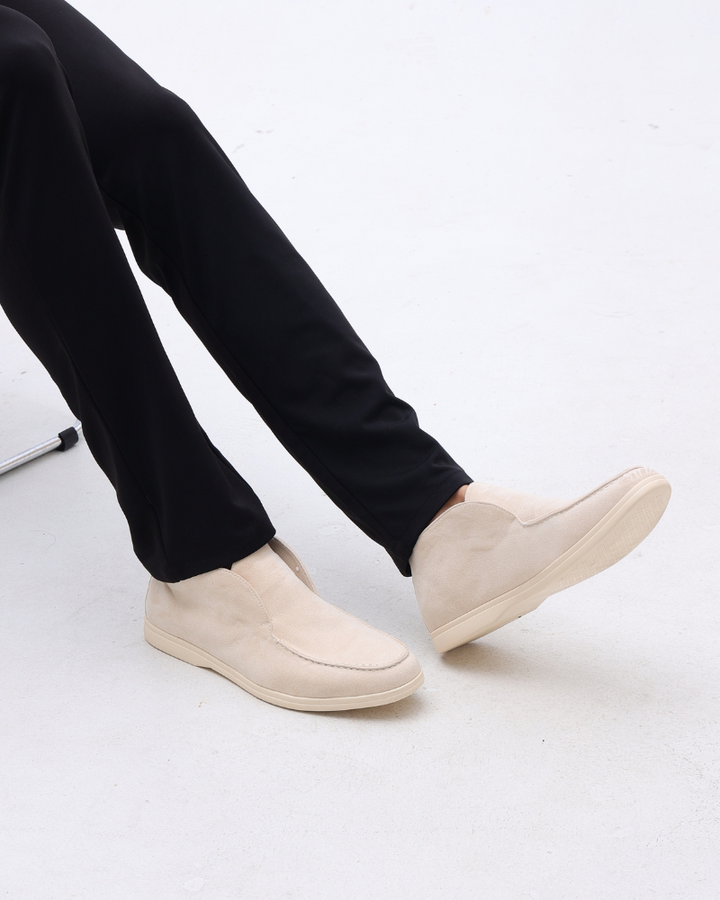 Elegant men's olive green suede loafers, a versatile addition to any wardrobe.