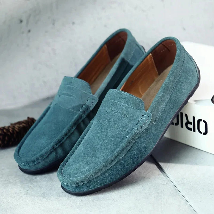 Men's comfortable slip-on suede loafers in a deep espresso shade with penny strap.
