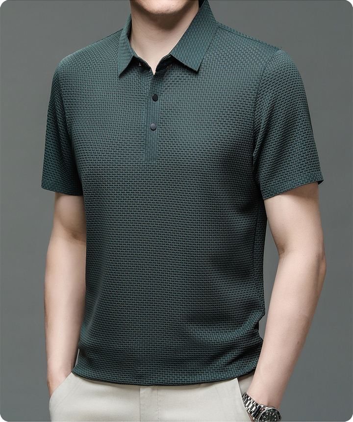 Detail of the button-up collar on a men's classic short sleeve polo shirt, highlighting quality and style.
